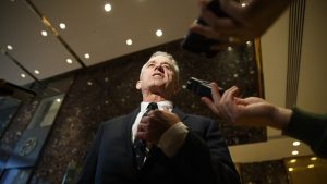Robert F. Kennedy Jr. talks with reporters in the lobby of Trump Tower in New York, Tuesday, Jan. 10, 2017, after meeting with President-elect Donald Trump. (AP Photo/Evan Vucci)